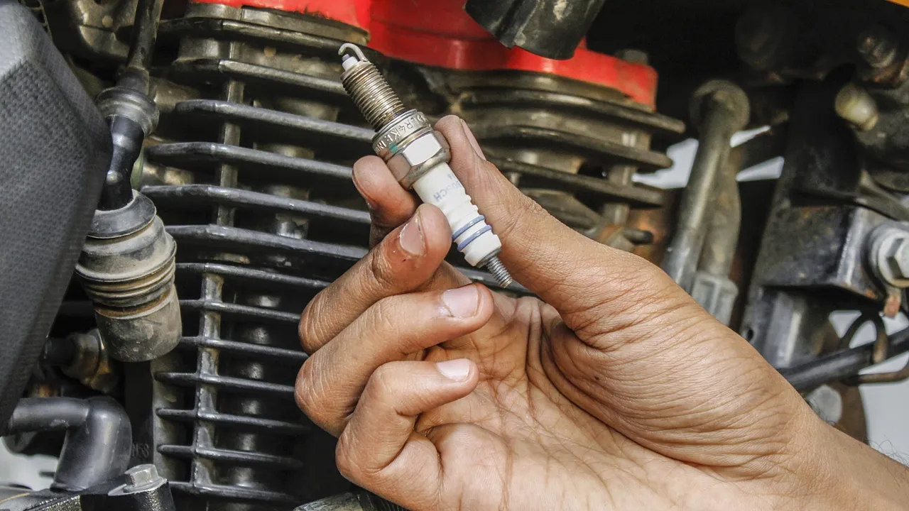 How to change spark plug in a motorcycle?